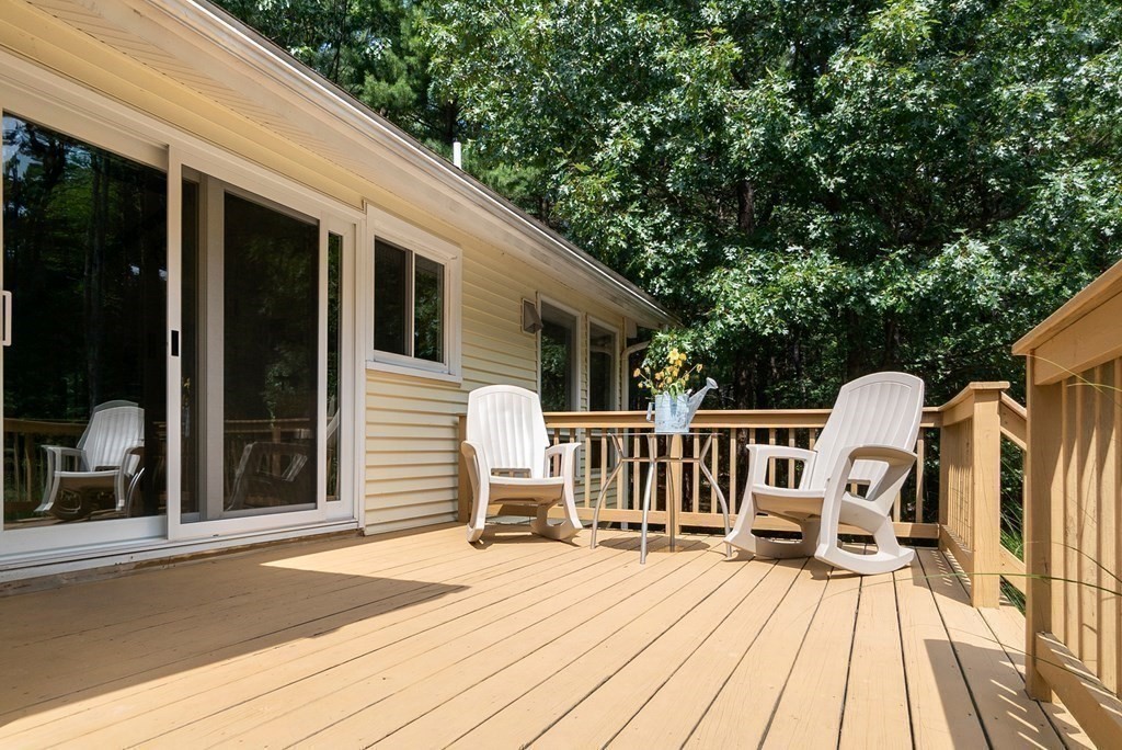 96 Old Mill Road Harvard, MA 01451 - Photo 6 of 32 a view of a wooden deck with a bench