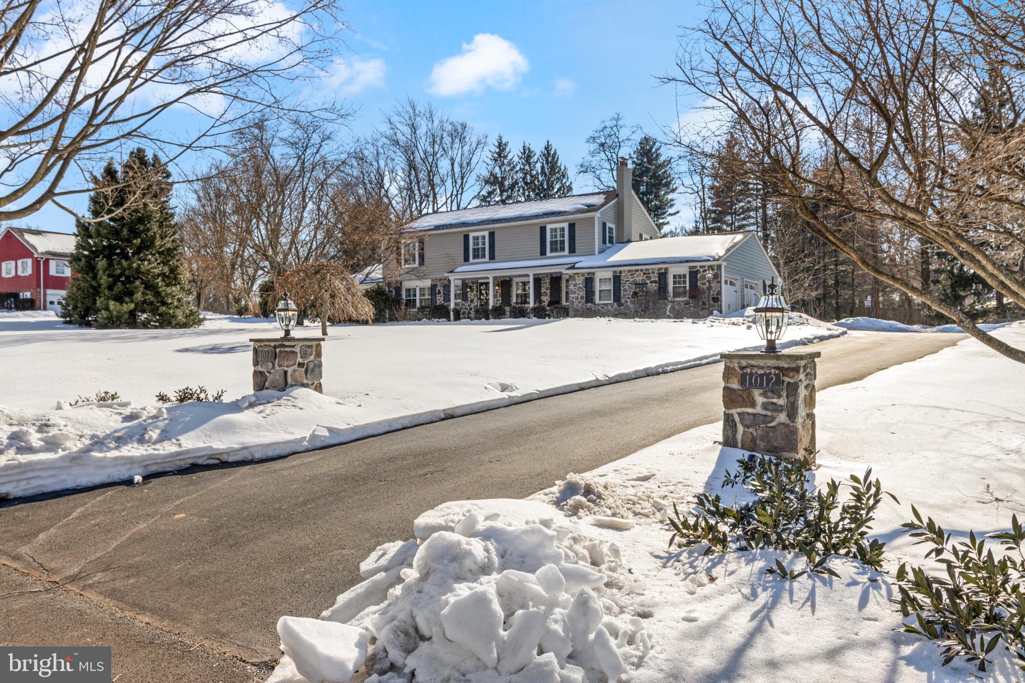 1012 Waltham Road Berwyn, PA 19312 - Photo 1 of 55 a front view of a house with a yard covered with snow