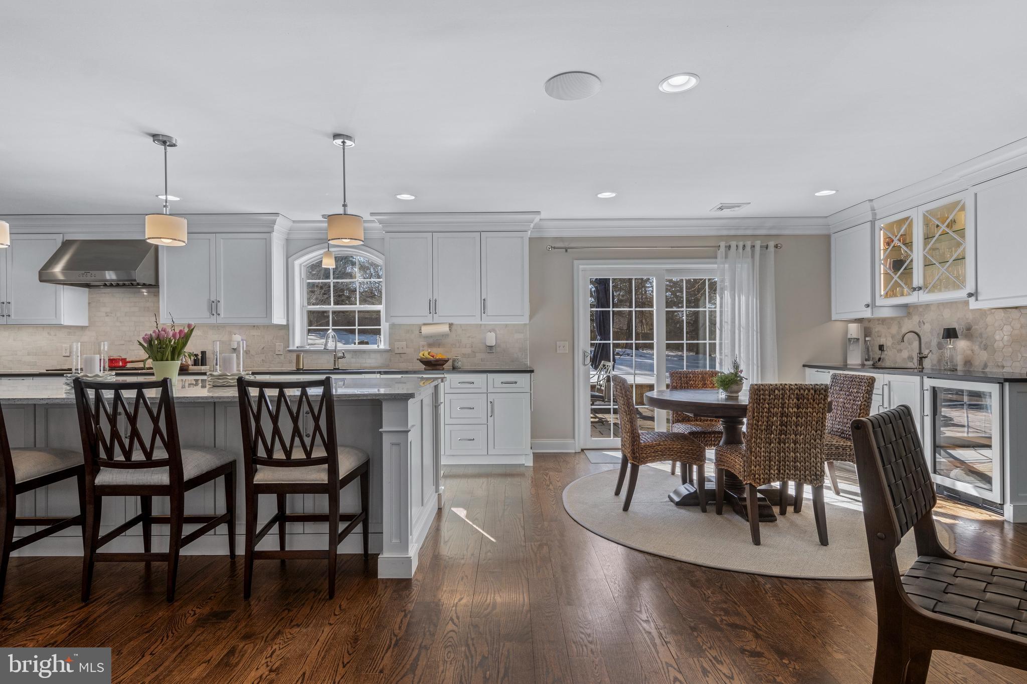 1012 Waltham Road Berwyn, PA 19312 - Photo 16 of 55 a view of kitchen with dining table chairs and wooden floor