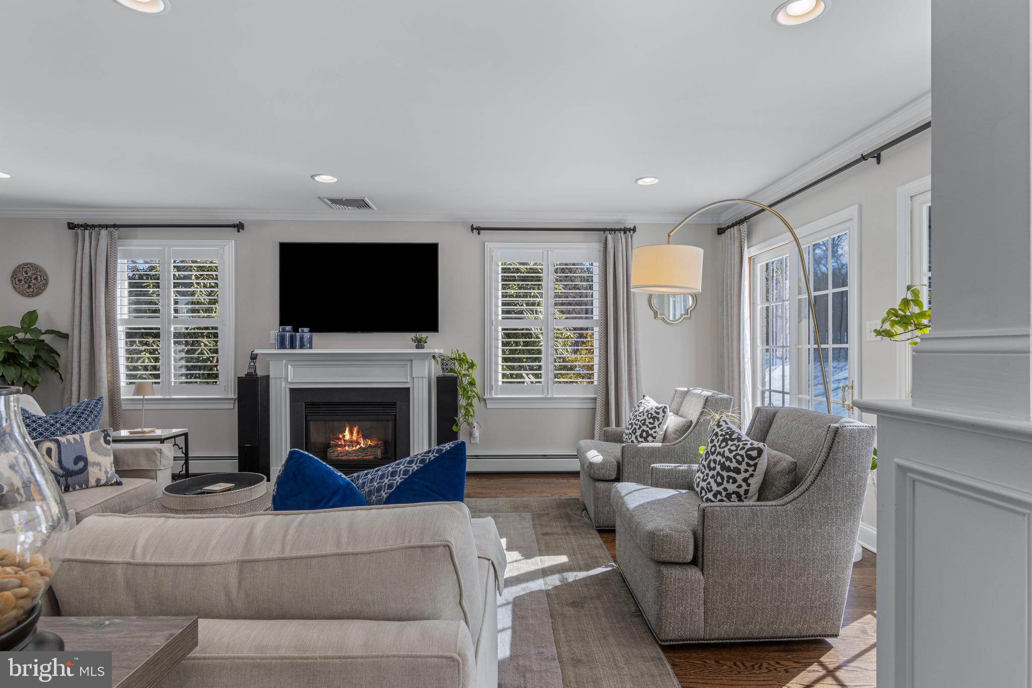 1012 Waltham Road Berwyn, PA 19312 - Photo 19 of 55 a living room with furniture a flat screen tv and a fireplace