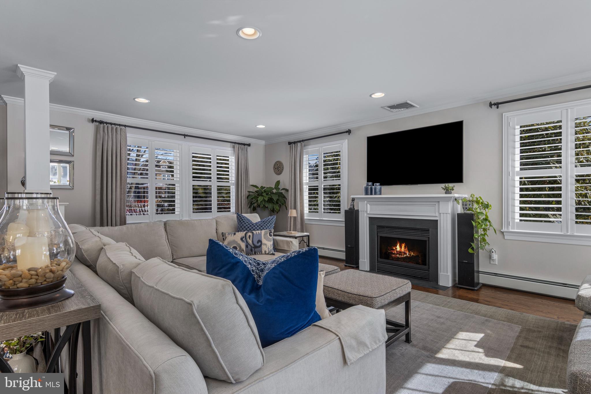 1012 Waltham Road Berwyn, PA 19312 - Photo 20 of 55 a living room with furniture flat screen tv and a fireplace