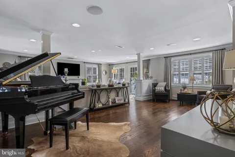 a living room with fireplace furniture and a flat screen tv
