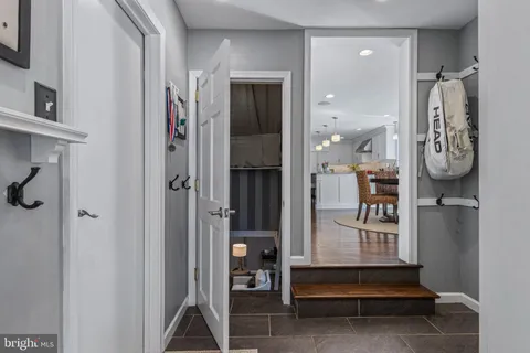 a spacious bathroom with a double vanity sink a mirror a vanity and a bathtub