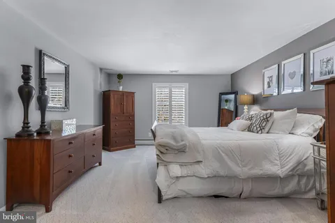 a view of a double vanity sink and a mirror light fixtures