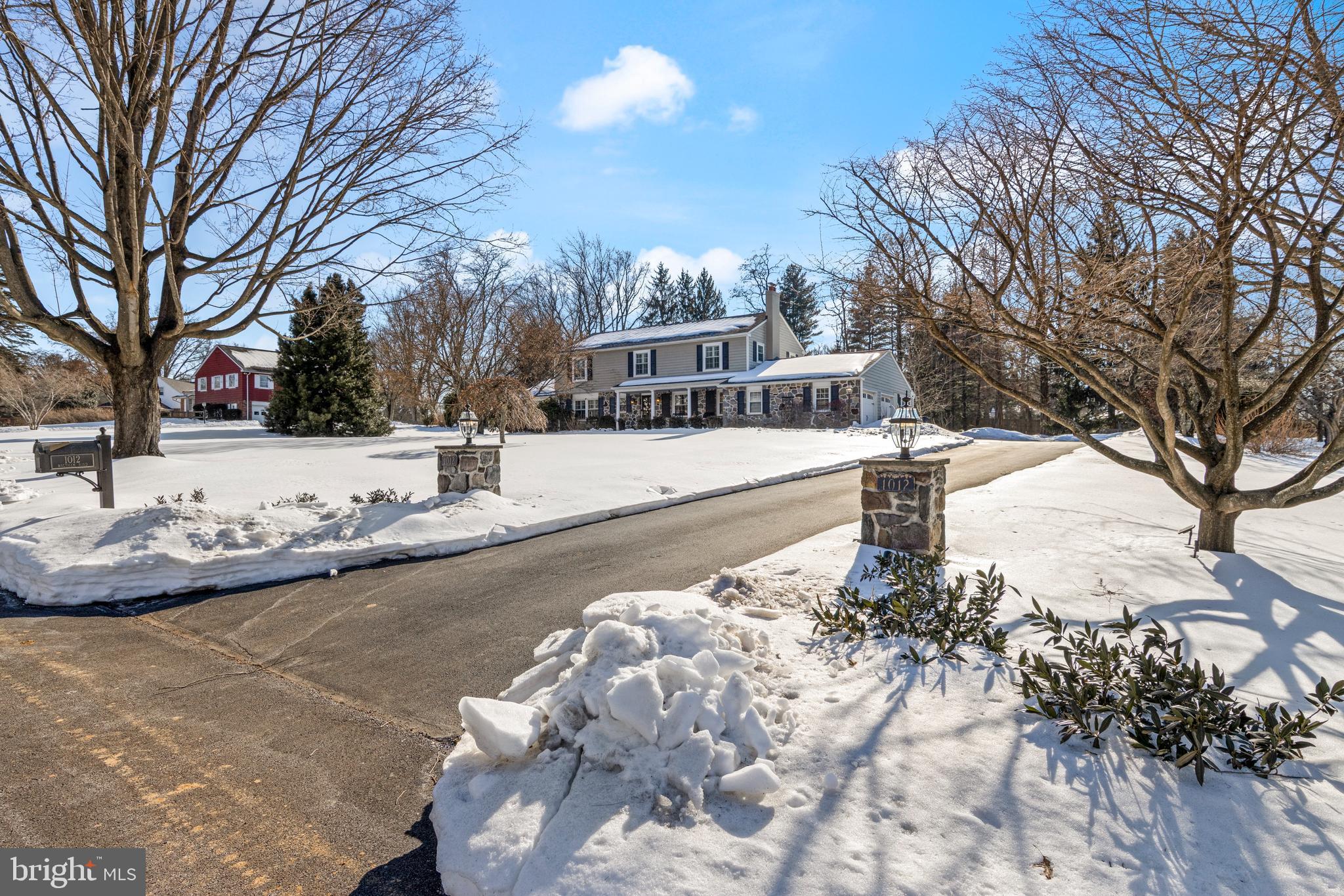 1012 Waltham Road Berwyn, PA 19312 - Photo 4 of 55 a front view of a house with a yard covered in snow