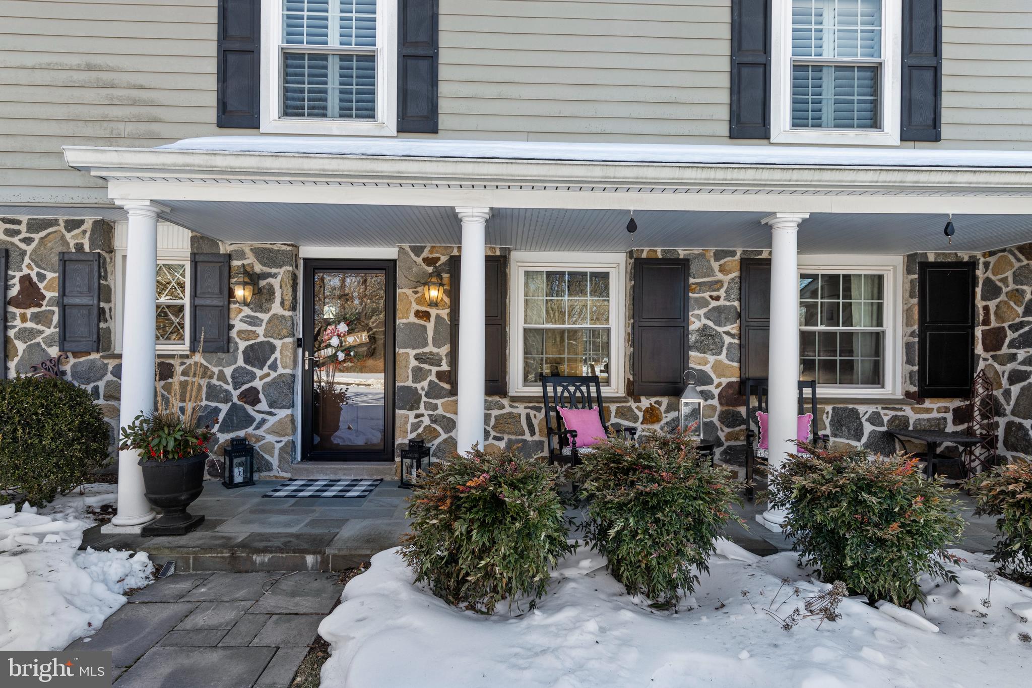 1012 Waltham Road Berwyn, PA 19312 - Photo 5 of 55 front view of a brick house with potted plants