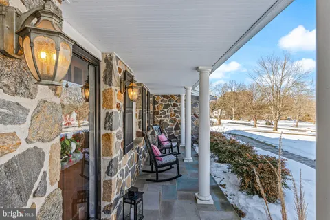 a view of entryway livingroom and hall with wooden floor