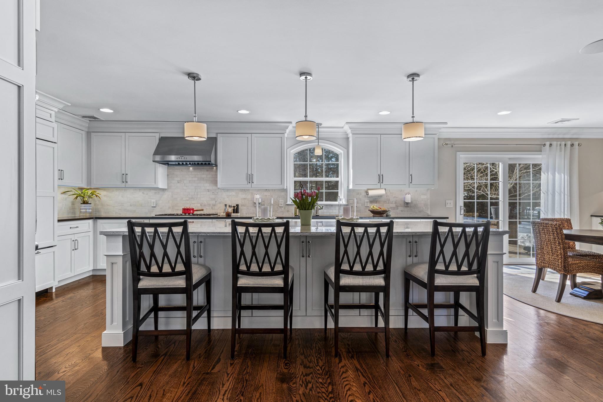 1012 Waltham Road Berwyn, PA 19312 - Photo 10 of 55 a kitchen with stainless steel appliances granite countertop a kitchen island hardwood floor and a sink