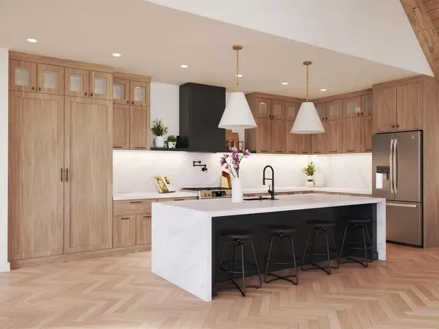 a kitchen with kitchen island a sink stainless steel appliances and cabinets
