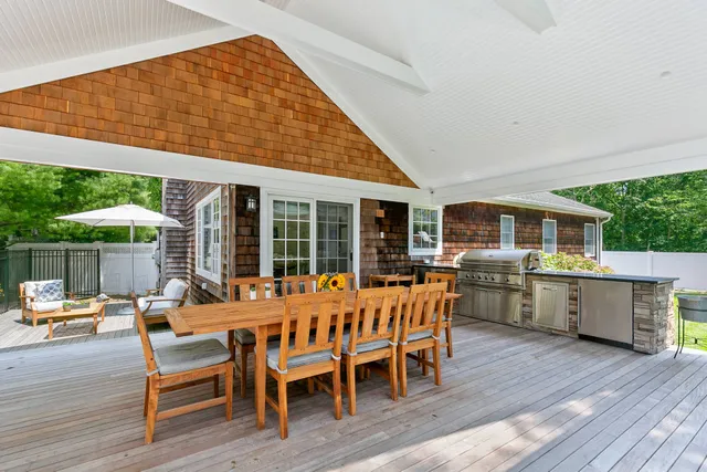 a outdoor space with a table and chairs