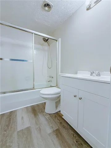 a bathroom with a toilet sink and a shower