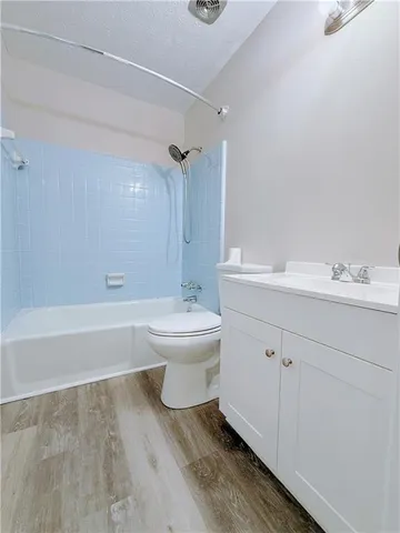 a bathroom with a sink toilet and bathtub