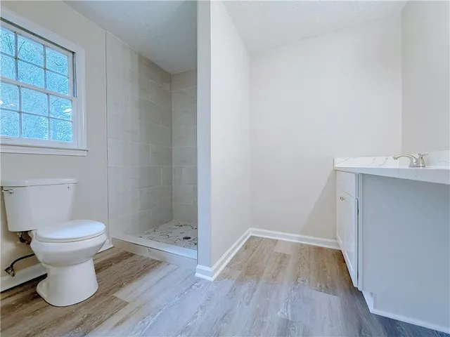 a bathroom with a toilet and a sink