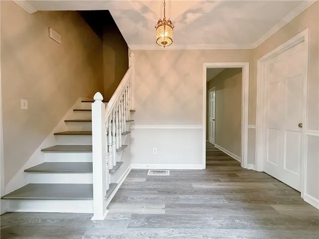 a view of entryway with wooden floor
