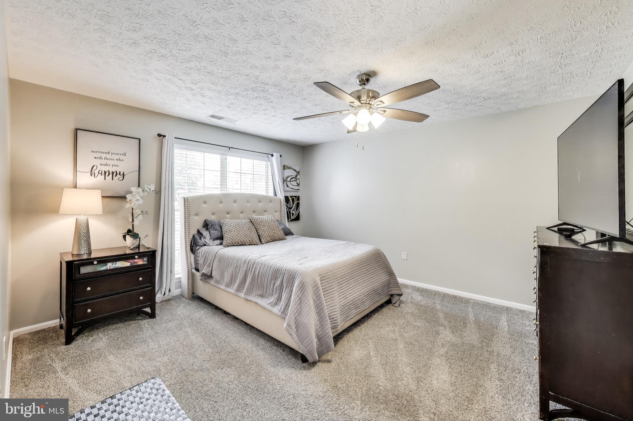 15602 Everglade Lane, Unit 2203 Bowie, MD 20716 - Photo 13 of 24 a bedroom with a bed and window
