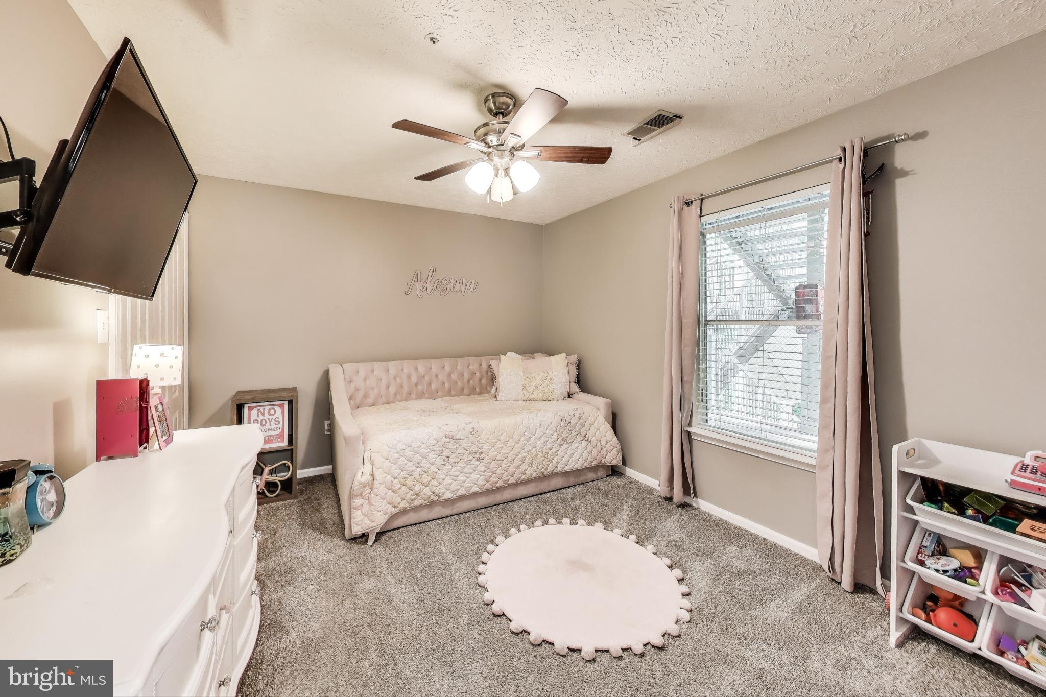 15602 Everglade Lane, Unit 2203 Bowie, MD 20716 - Photo 17 of 24 a living room with furniture and a window