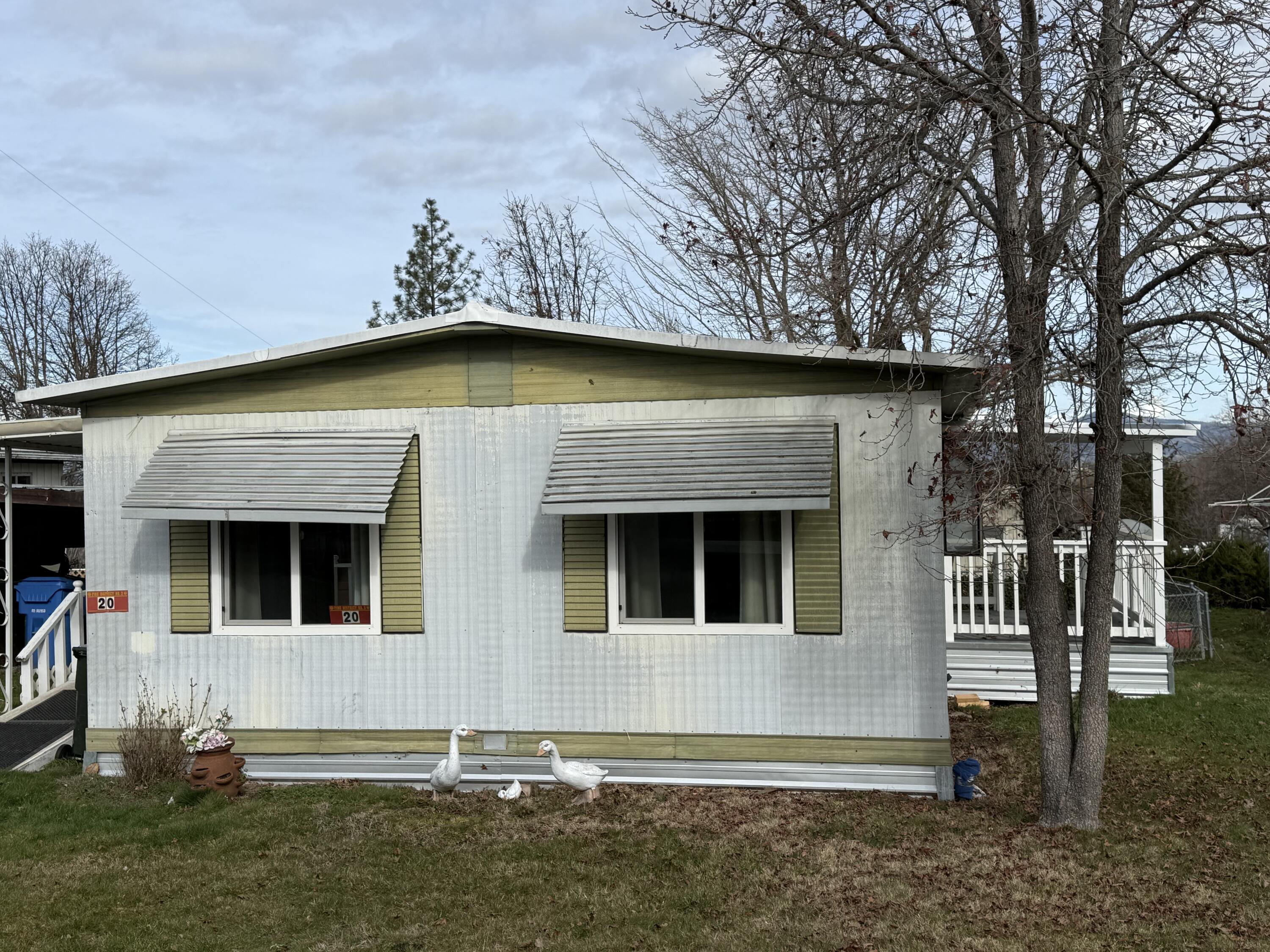 421 Stevens Road, Unit 20 Eagle Point, OR 97524 - Photo 2 of 22 a front view of a house with garage