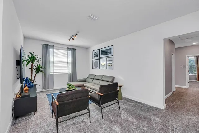 a living room with furniture and window