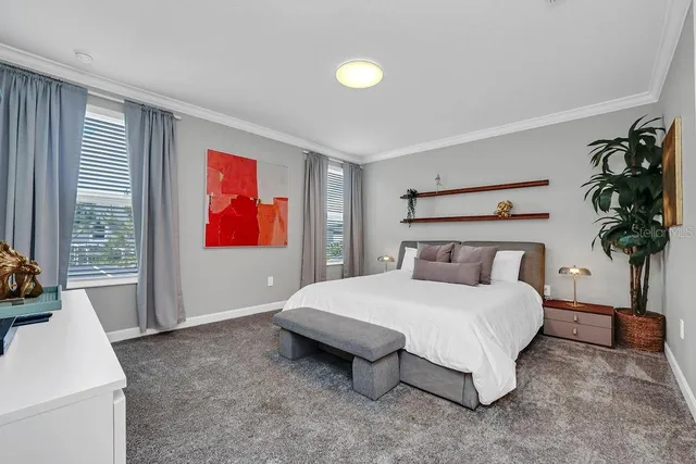 a bedroom with a bed and a couch