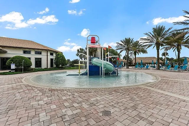 a view of swimming pool with outdoor seating