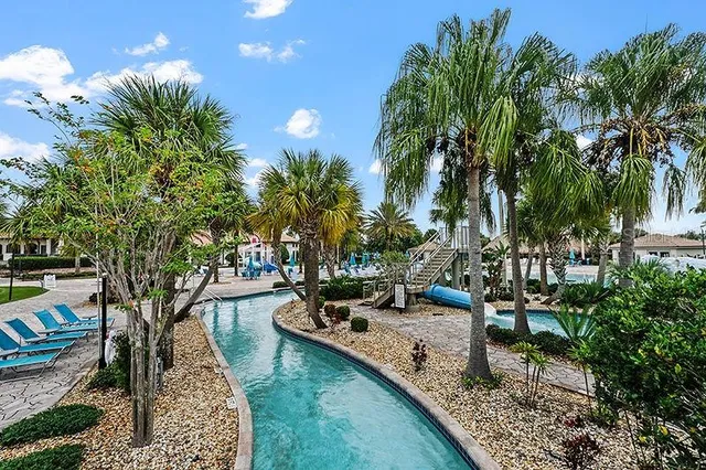a view of a backyard with sitting area