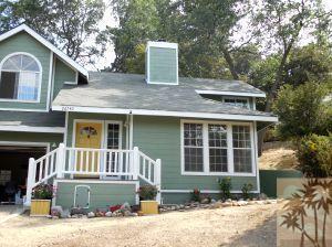 25740 Saunders Meadow Road Idyllwild, CA 92549 - Photo 1 of 16 a front view of a house with a yard