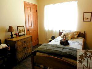 25740 Saunders Meadow Road Idyllwild, CA 92549 - Photo 11 of 16 a bedroom with a bed and wooden floor