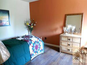 25740 Saunders Meadow Road Idyllwild, CA 92549 - Photo 12 of 16 a bedroom with a bed and a dresser