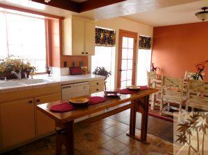 25740 Saunders Meadow Road Idyllwild, CA 92549 - Photo 6 of 16 a kitchen with a table chairs and a window