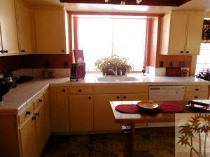 25740 Saunders Meadow Road Idyllwild, CA 92549 - Photo 7 of 16 a kitchen with a sink cabinets and a table