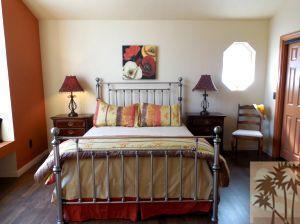 25740 Saunders Meadow Road Idyllwild, CA 92549 - Photo 9 of 16 a bed sitting in a bedroom next to a window