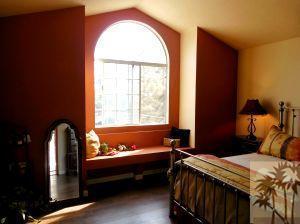 25740 Saunders Meadow Road Idyllwild, CA 92549 - Photo 10 of 16 a bedroom with a bed and a window