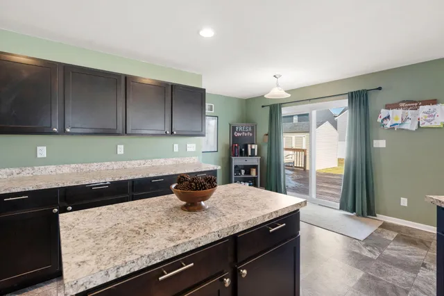 a kitchen with a sink and cabinets