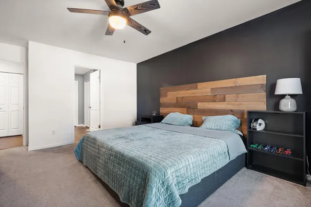 a bedroom with a bed and closet