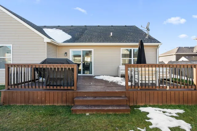 a view of a house with a yard and furniture