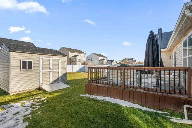 a view of a house with backyard and porch