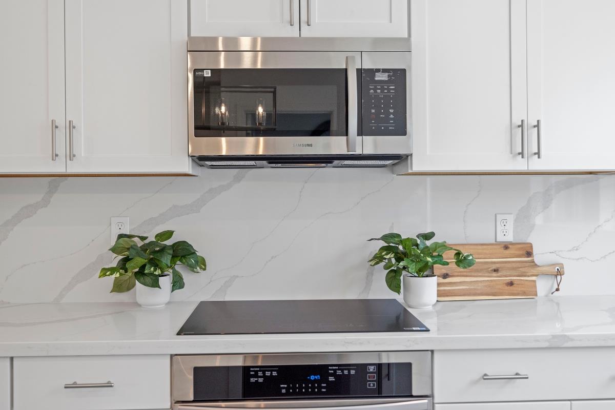3775 Castro Valley Boulevard Castro Valley, CA 94546 - Photo 12 of 35 a kitchen with a potted plant on the counter and cabinets