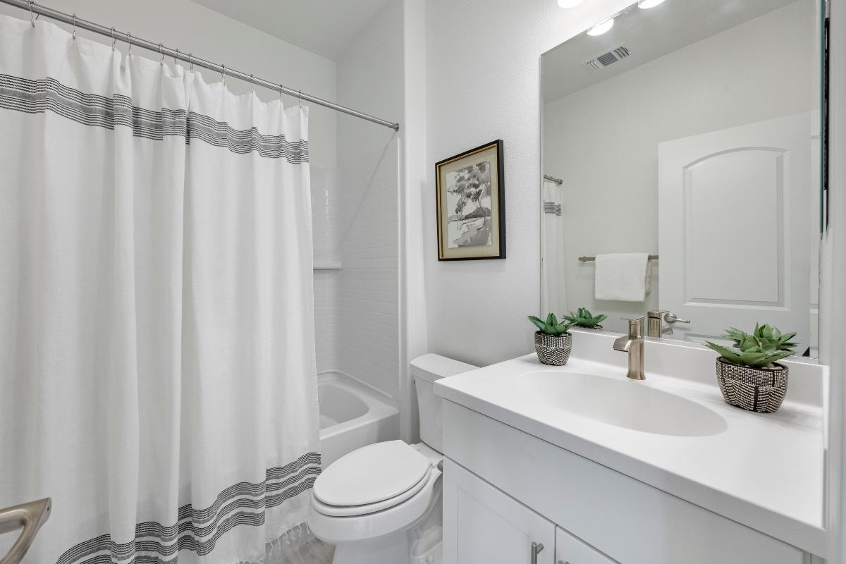 3775 Castro Valley Boulevard Castro Valley, CA 94546 - Photo 20 of 35 a bathroom with a sink a toilet and a mirror