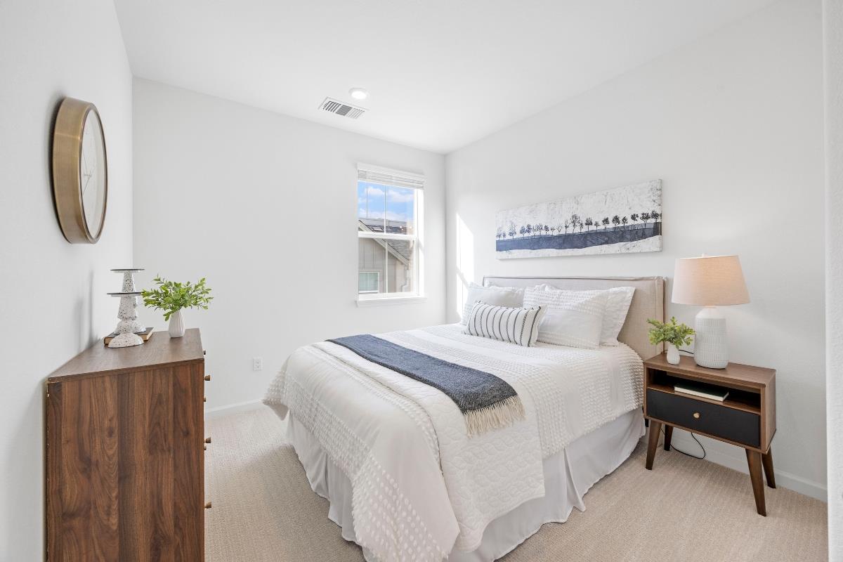 3775 Castro Valley Boulevard Castro Valley, CA 94546 - Photo 23 of 35 a bedroom with a bed lamp and a potted plant
