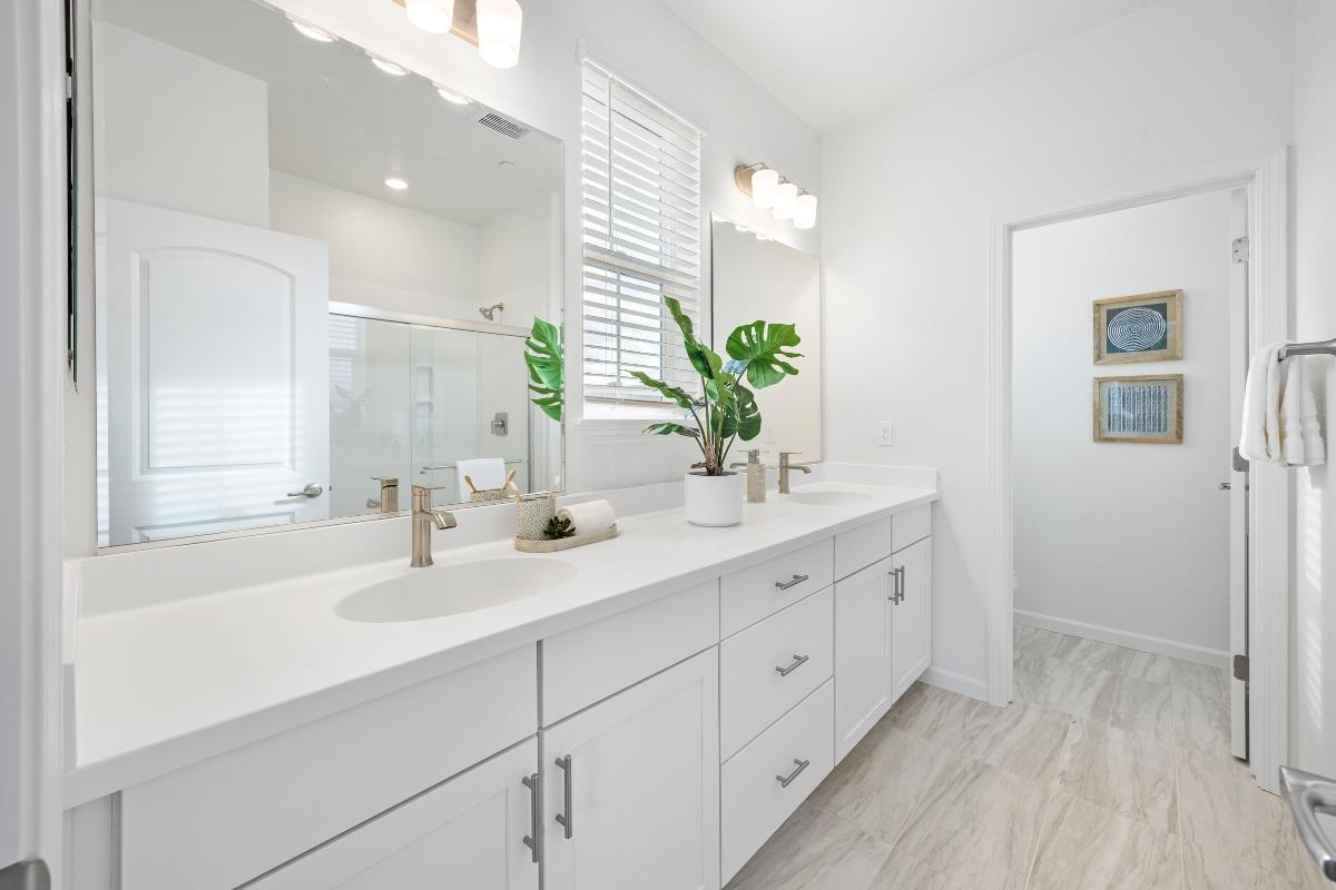 3775 Castro Valley Boulevard Castro Valley, CA 94546 - Photo 26 of 35 a bathroom with a double vanity sink and a mirror