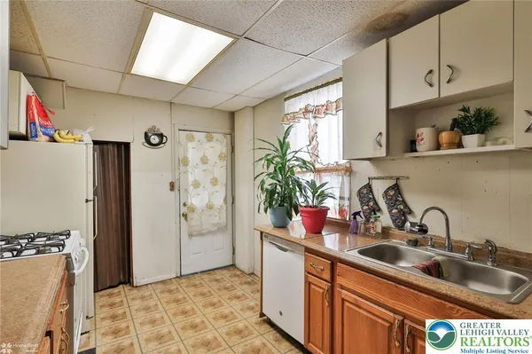 a white refrigerator freezer sitting in a kitchen