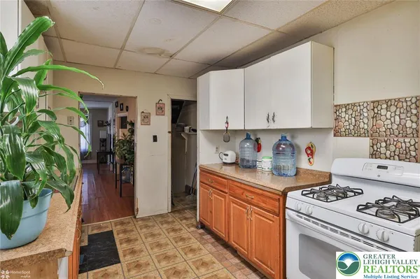 a kitchen with stainless steel appliances a sink and a refrigerator