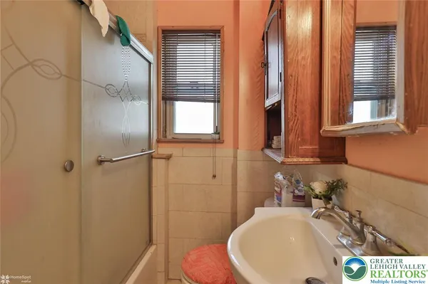 a bathroom with sink and a mirror