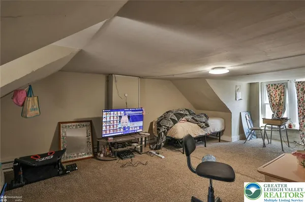 a view of a workspace with furniture