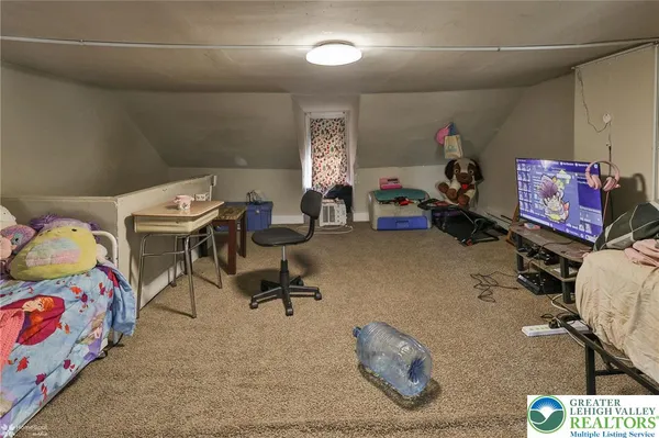a room with furniture and a flat screen tv