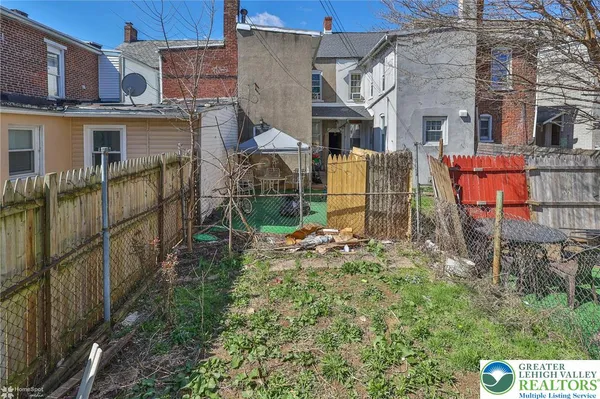 a view of backyard with a garden and plants