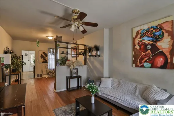 a living room with furniture and a flat screen tv