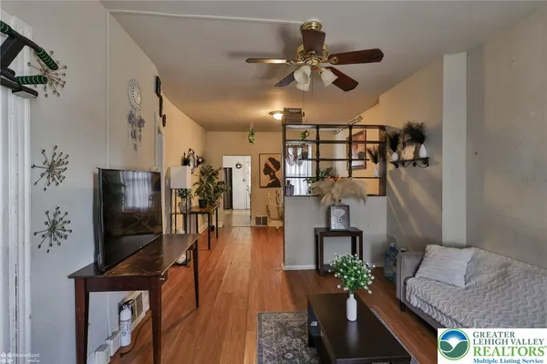 a living room with furniture and a window