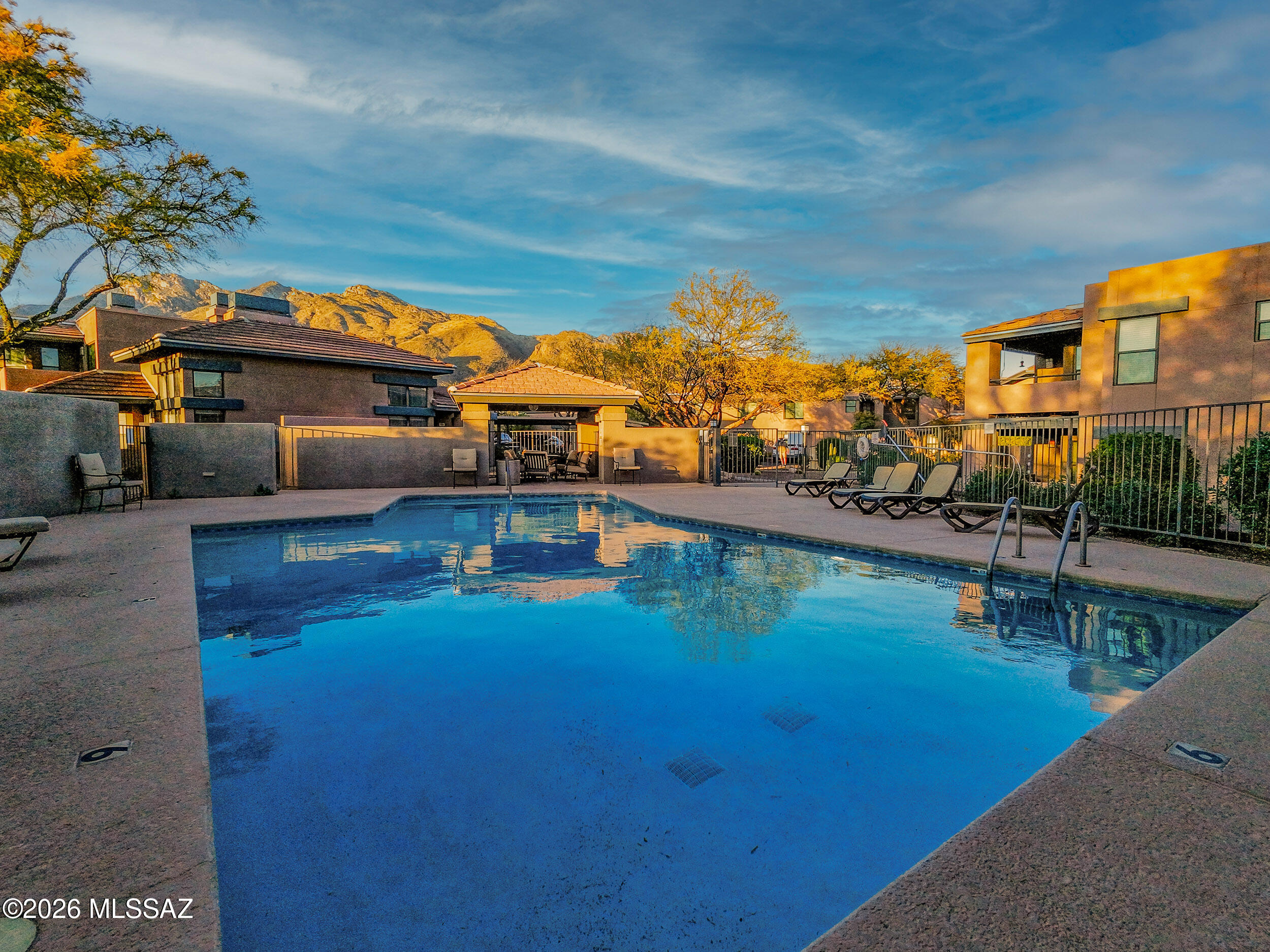5855 North Kolb Road, Unit 6103 Tucson, AZ 85750 - Photo 21 of 31 a view of a swimming pool with a patio