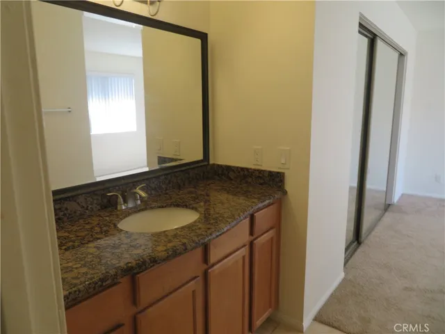 a kitchen with stainless steel appliances granite countertop a stove a refrigerator and a microwave